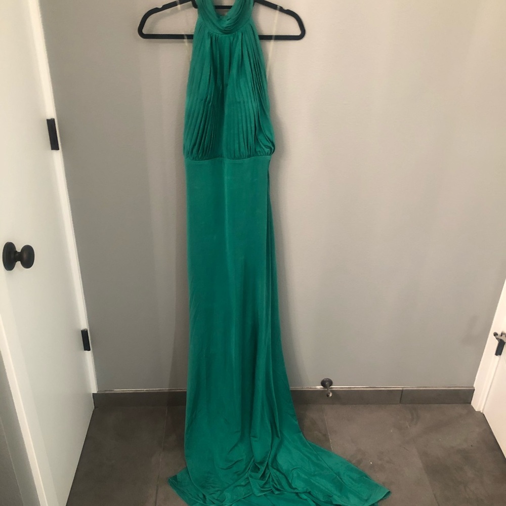 Emerald green, backless silk dress with train.